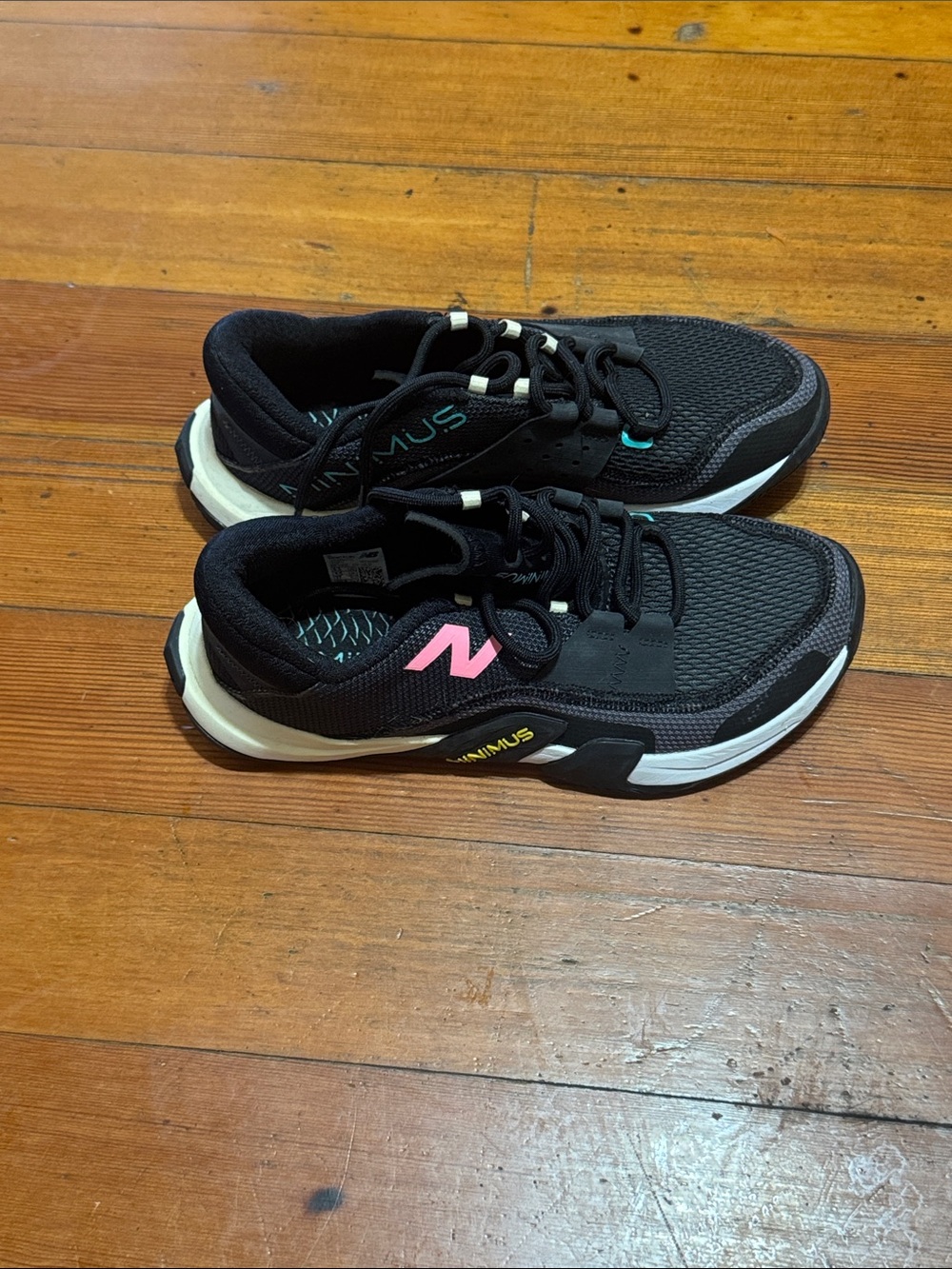 New Balance Black Sneakers with Pink Logo and White Sole